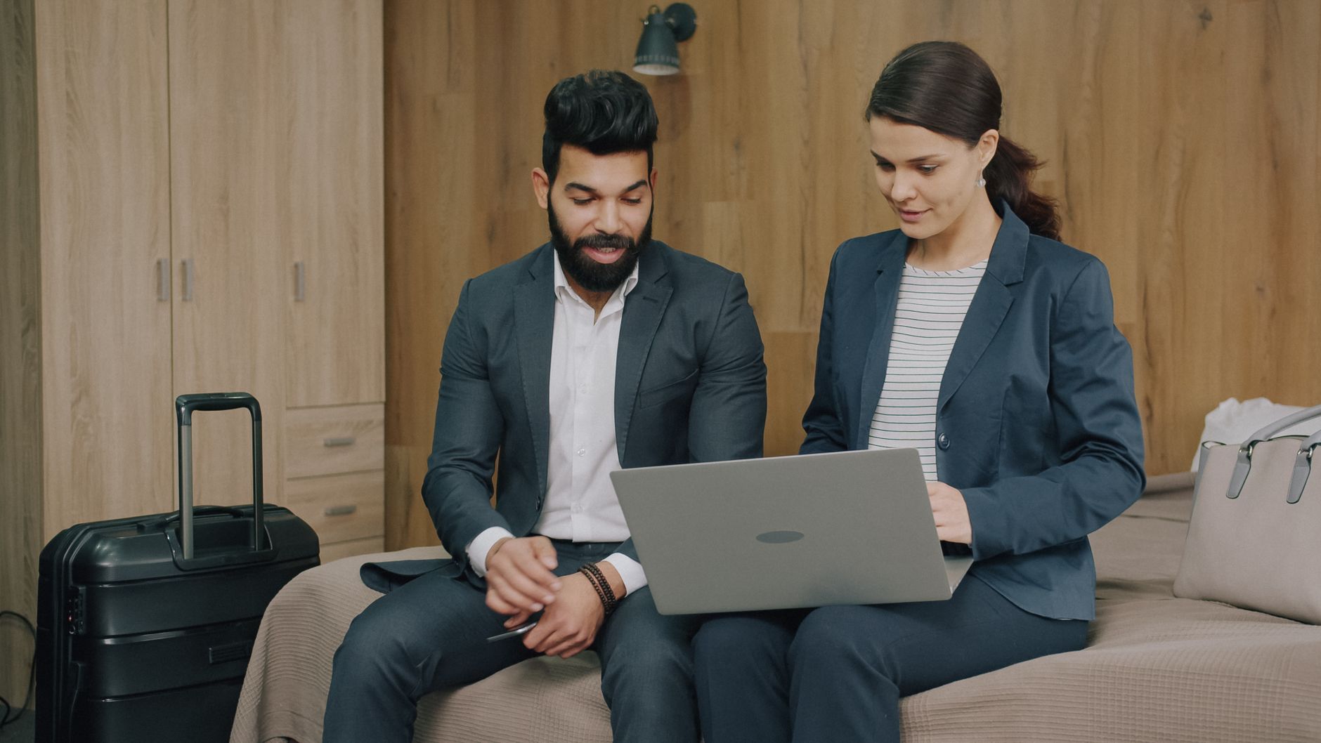 person booking travel laptop hotel